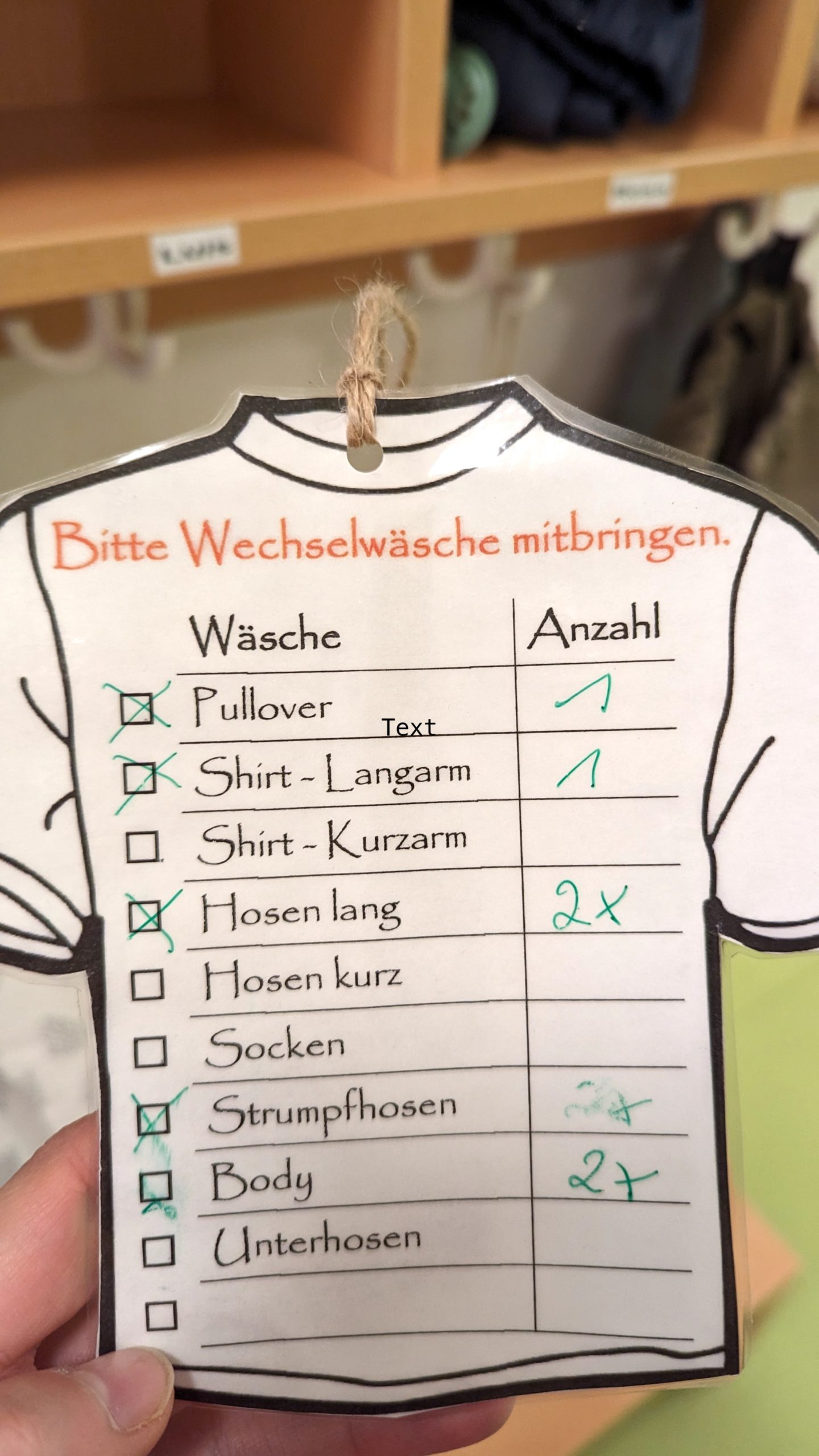 Wechselwäsche-Liste der Krippe zum Ankreuzen – Beispiel für Mental Load im Familienalltag